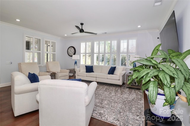 living room with crown molding, ceiling fan, and dark hardwood / wood-style floors