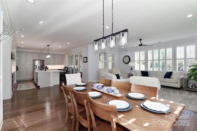 dining space featuring ornamental molding, dark hardwood / wood-style floors, and ceiling fan