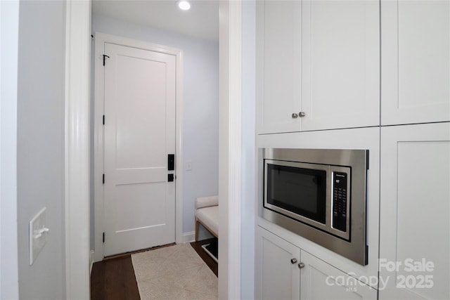 interior space with dark hardwood / wood-style flooring