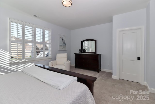 bedroom with light colored carpet