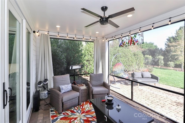 sunroom / solarium with ceiling fan