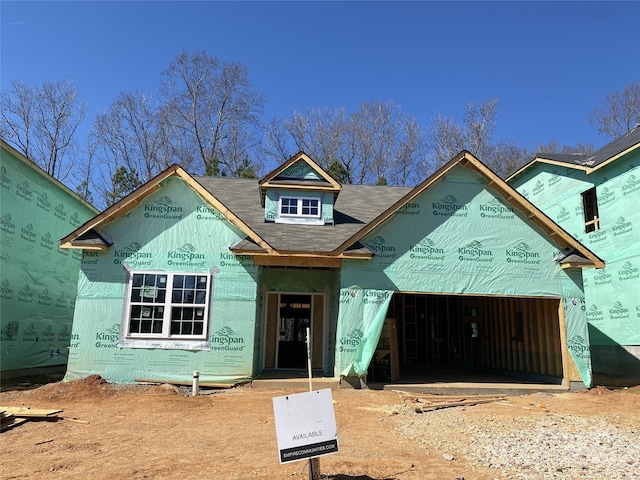 unfinished property featuring a garage