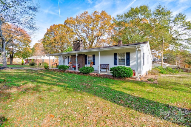 view of front of property with a porch and a front yard