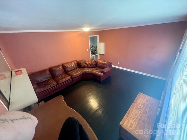 living room featuring dark hardwood / wood-style flooring and ornamental molding