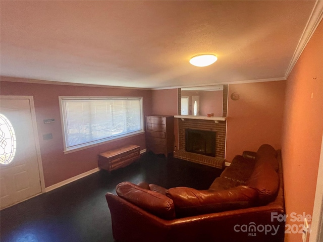 living room featuring vaulted ceiling, ornamental molding, a textured ceiling, and a brick fireplace