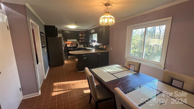 tiled dining room featuring a chandelier, crown molding, and sink