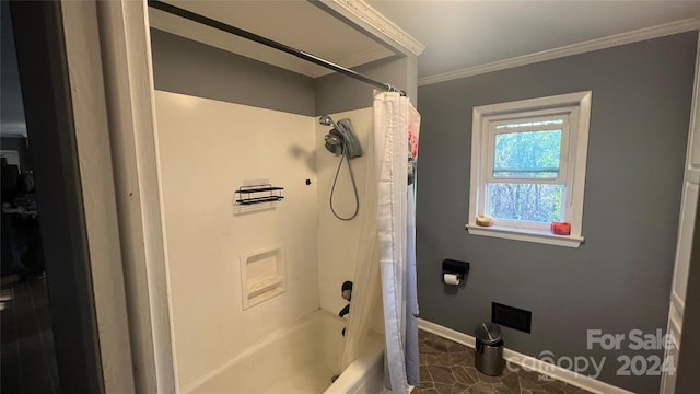 bathroom featuring tile patterned floors, crown molding, and shower / bath combo