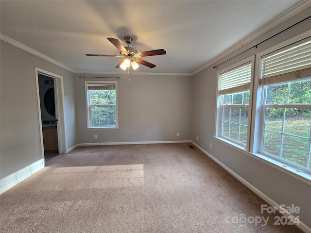 carpeted empty room featuring ceiling fan and ornamental molding