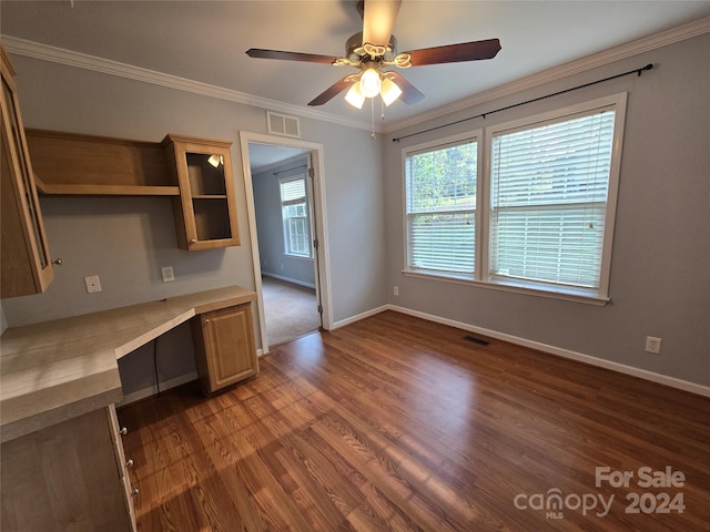 kitchen featuring built in desk, dark hardwood / wood-style floors, ceiling fan, and ornamental molding