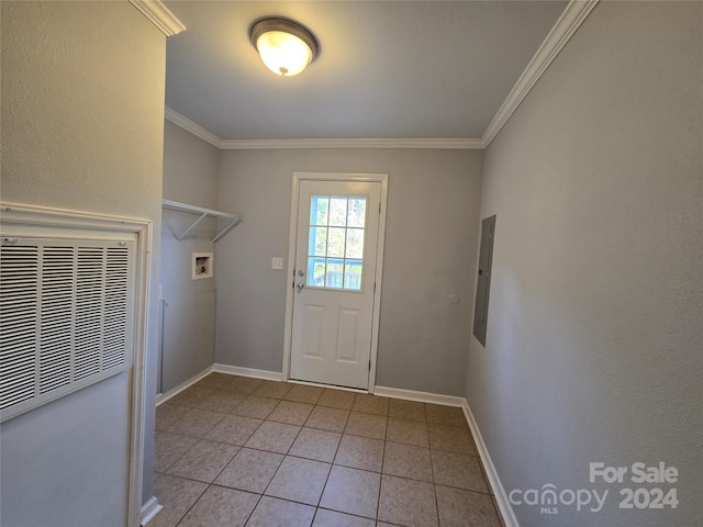 entryway featuring ornamental molding and light tile patterned flooring