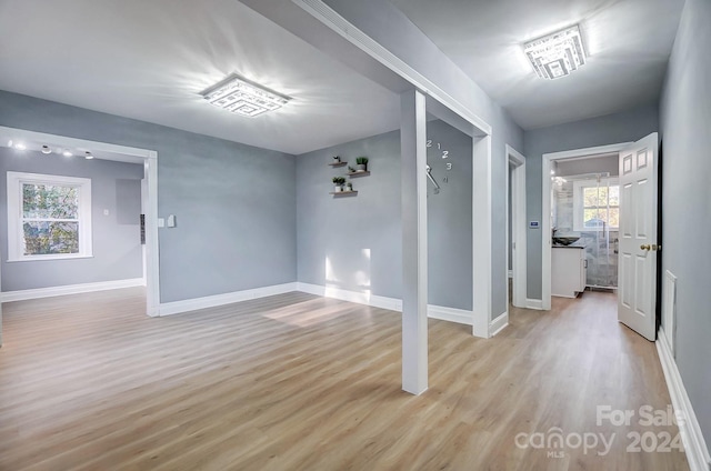 spare room with light wood-type flooring