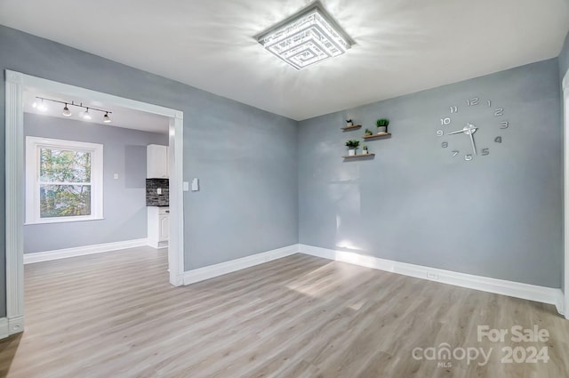 empty room with light wood-type flooring