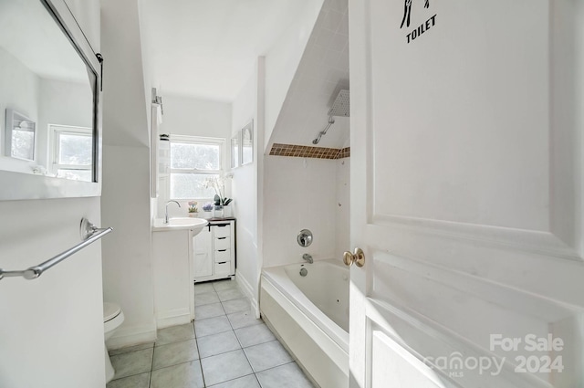 full bathroom featuring tile patterned floors, vanity, toilet, and tiled shower / bath