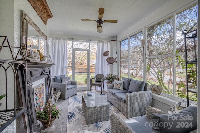 sunroom featuring plenty of natural light and ceiling fan