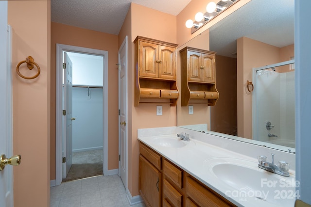 bathroom featuring vanity and a textured ceiling