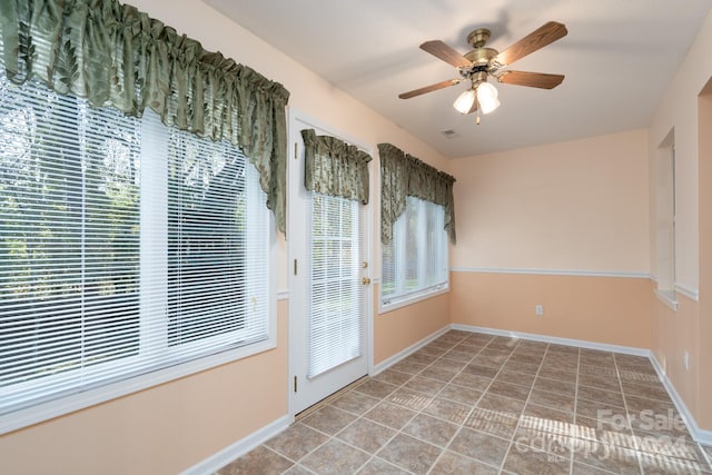 interior space featuring ceiling fan and light tile patterned flooring