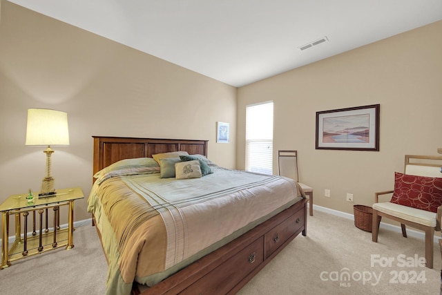 bedroom with light colored carpet