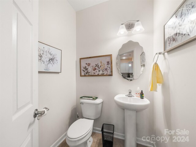 bathroom with sink, tile patterned flooring, and toilet