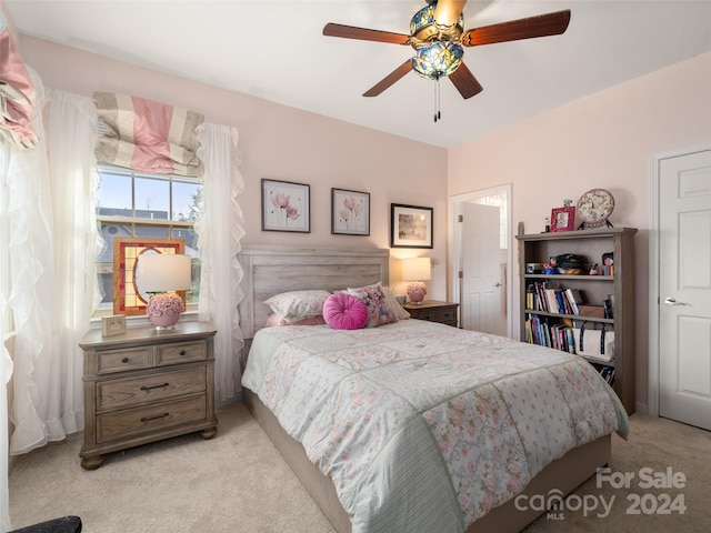 carpeted bedroom featuring ceiling fan