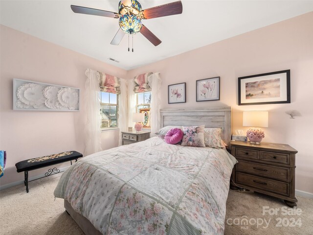 carpeted bedroom with ceiling fan