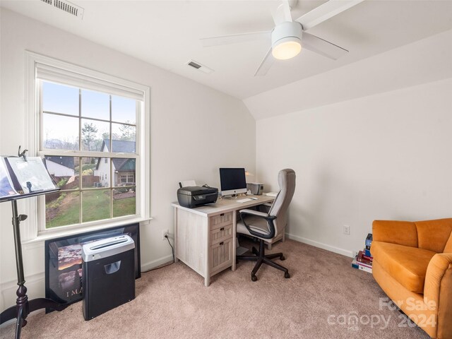 home office featuring ceiling fan, light colored carpet, and lofted ceiling