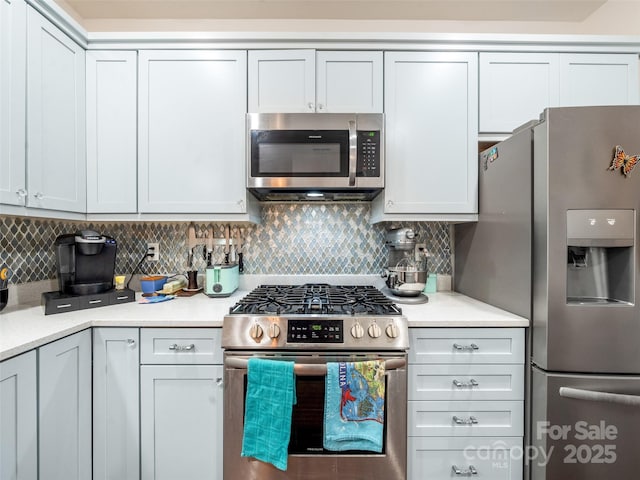 503 Rosebud Orchid Way, Weaverville, NC 28787 - kitchen with appliances with stainless steel finishes, light countertops, and decorative backsplash