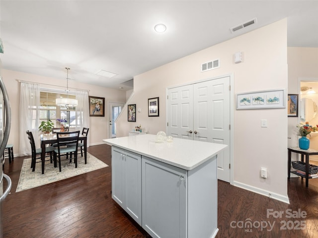 503 Rosebud Orchid Way, Weaverville, NC 28787 - kitchen with light countertops, dark wood finished floors, a kitchen island, and baseboards