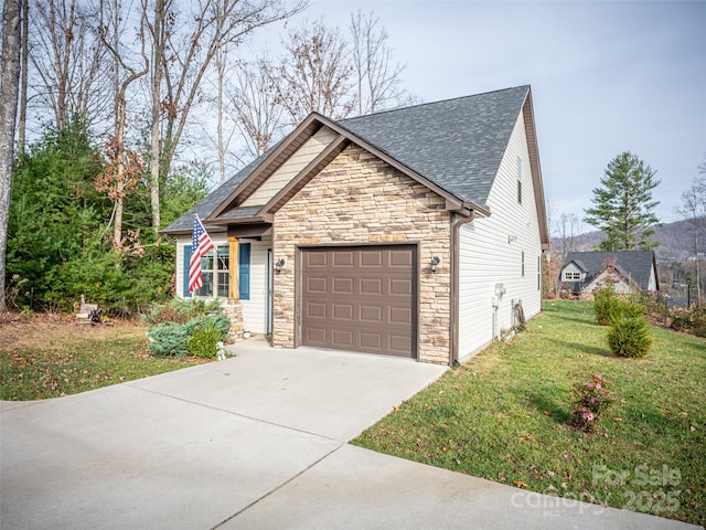 503 Rosebud Orchid Way, Weaverville, NC 28787 - view of front of property featuring stone siding, a shingled roof, a front lawn, an attached garage, and driveway