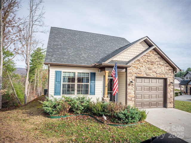 503 Rosebud Orchid Way, Weaverville, NC 28787 - view of front of home featuring stone siding, a garage, driveway, a shingled roof, and a front lawn