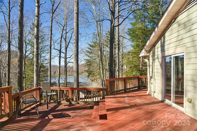 wooden deck with a water view