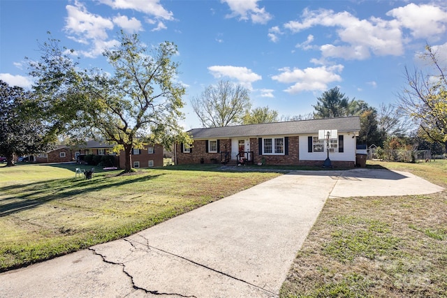 ranch-style home with a front lawn