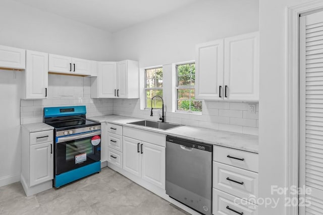 612 E E St, Newton, NC 28658 - kitchen with stainless steel appliances, a sink, and white cabinets