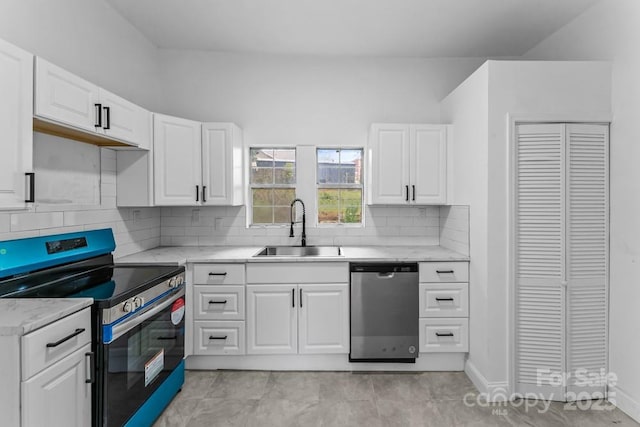 612 E E St, Newton, NC 28658 - kitchen with stainless steel appliances, a sink, white cabinetry, decorative backsplash, and baseboards