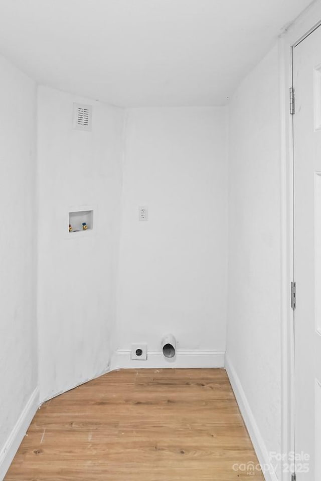 612 E E St, Newton, NC 28658 - clothes washing area with hookup for an electric dryer, hookup for a washing machine, light wood-style flooring, and baseboards