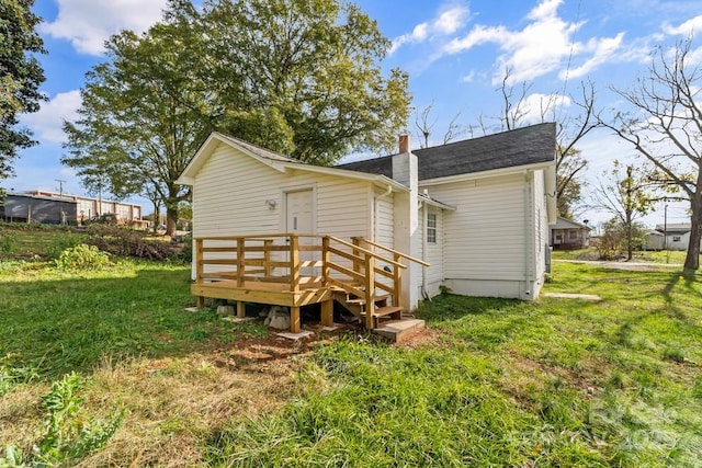 612 E E St, Newton, NC 28658 - back of house with a chimney and a yard