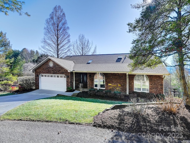 single story home featuring a garage and a front lawn