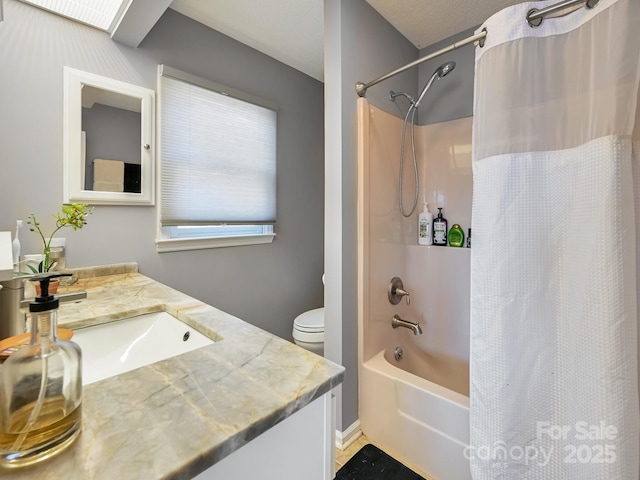 full bathroom featuring vanity, shower / tub combo, and toilet