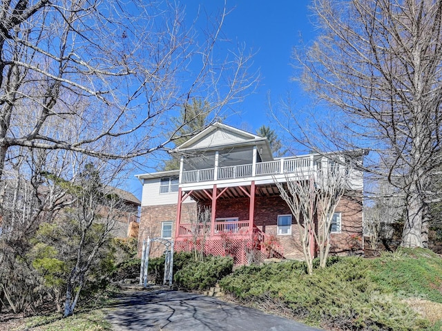 neoclassical home with ceiling fan and covered porch