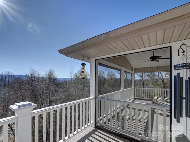 wooden deck with ceiling fan