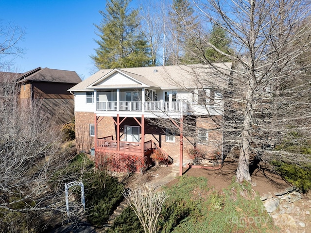 rear view of property with a balcony