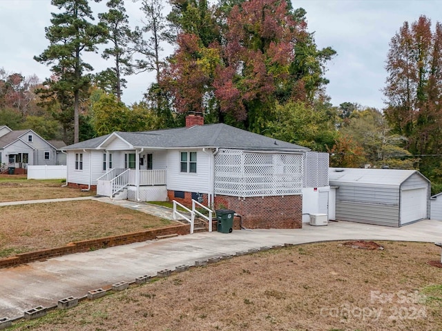 view of front of home featuring an outbuilding and a garage