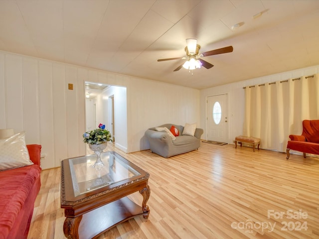 living room with ceiling fan and wood-type flooring