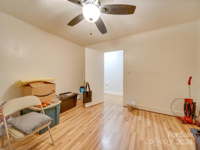 misc room with light wood-type flooring and ceiling fan