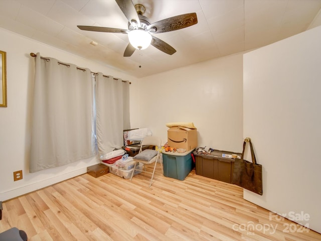 interior space with ceiling fan and hardwood / wood-style floors