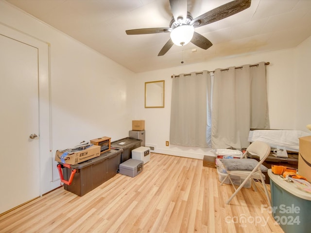 sitting room featuring hardwood / wood-style floors and ceiling fan