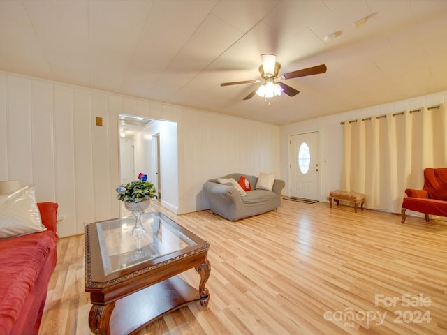 living room with hardwood / wood-style flooring and ceiling fan