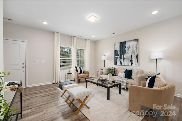 living room with light hardwood / wood-style floors