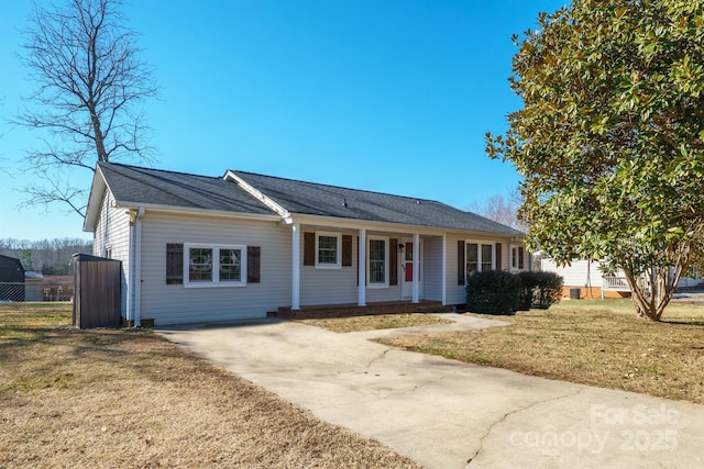 ranch-style home with a porch and a front lawn