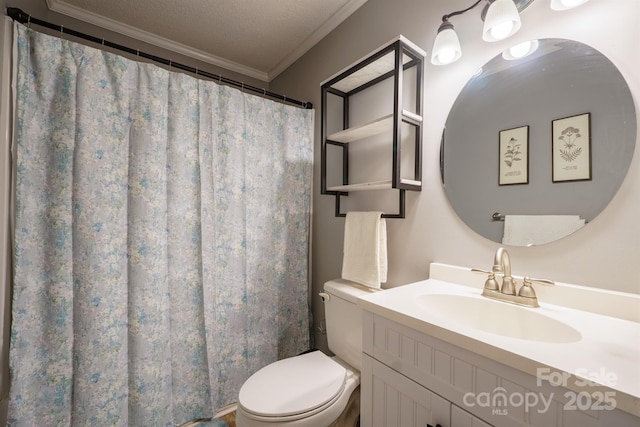 bathroom featuring ornamental molding, toilet, vanity, and a textured ceiling