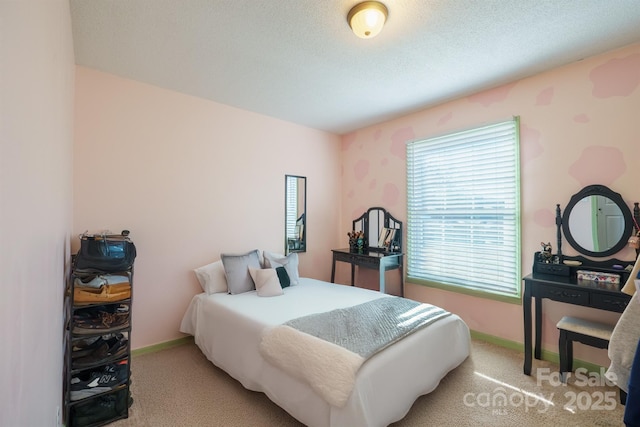 carpeted bedroom with a textured ceiling